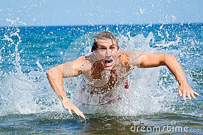 Man swimming butterfly strokes