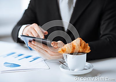 Man with tablet pc and cup of coffee