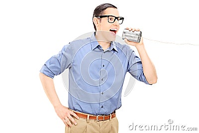 Man talking through a tin can phone