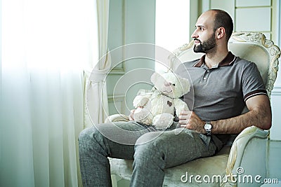 Man with teddy bear