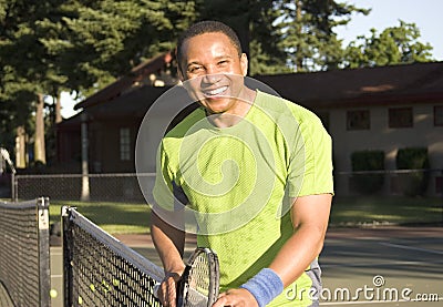 Man on Tennis Court Playing Tennis