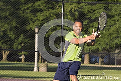 Man on Tennis Court Playing Tennis