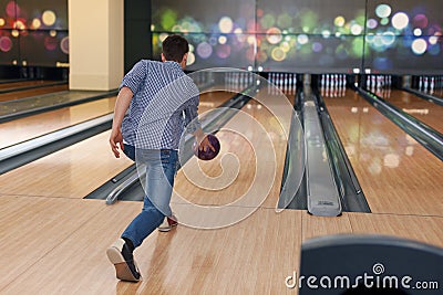 Man throwing bowling ball