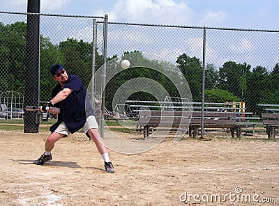 Man about to hit a softball