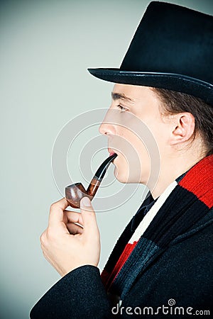 Man in top hat smoking a pipe