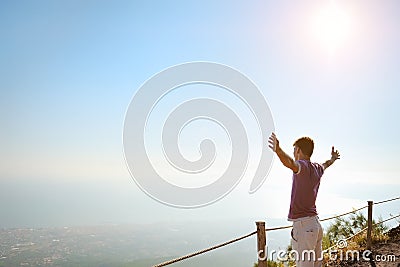 Man on top of a mountain looking for horizon