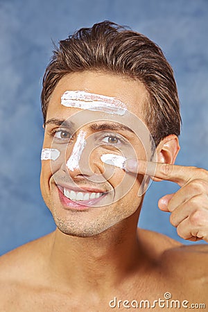 Man treating his face with skin