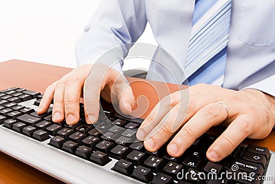 Man typing in the computer