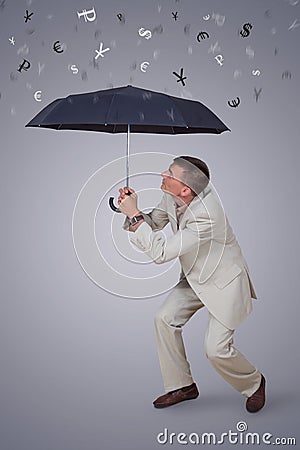 Man with umbrella under rain currency