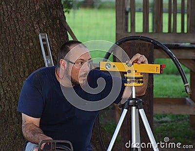 Man Using Laser Level