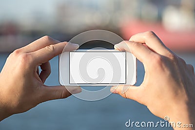 Man using mobile phone in the park as camera