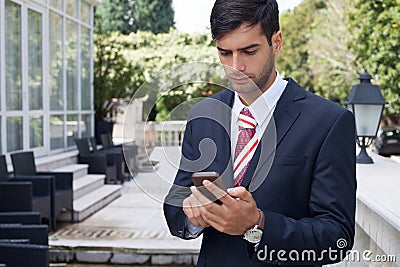 Man using a smart phone on the street