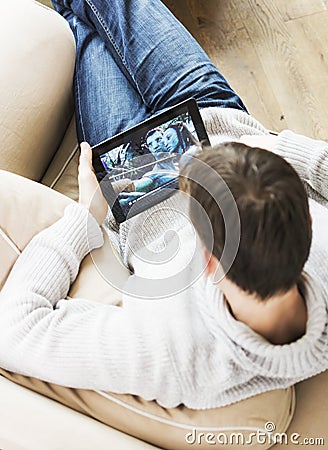 Man watching movie avatar on iPad