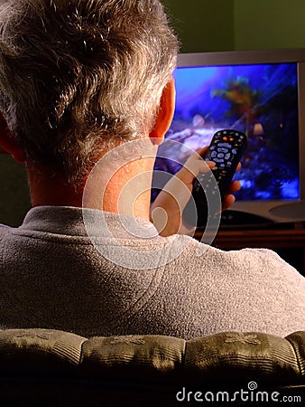 Man watching TV with Remote
