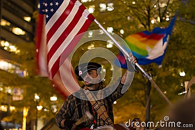 Man waving the American flag at Occupy Wall Street