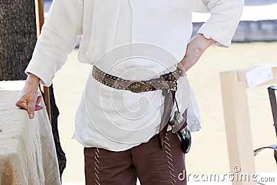 Man Wearing An Old Belt