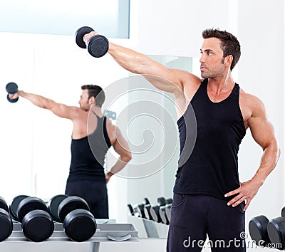 Man with weight training equipment on sport gym