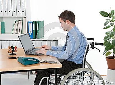 Man in wheelchair in the office