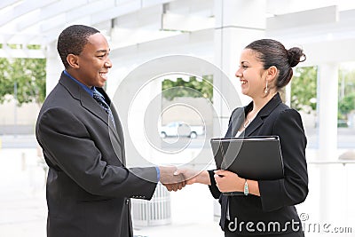 Man and Woman Business Team Handshake