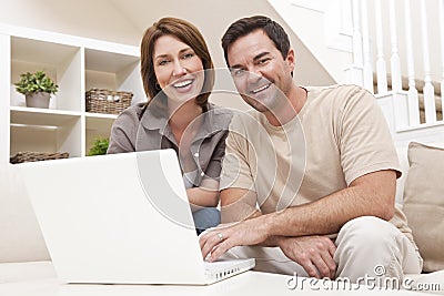 Man Woman Couple Using Laptop Computer At Home