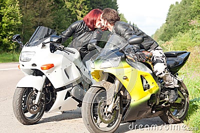 Man and woman on motorcycles