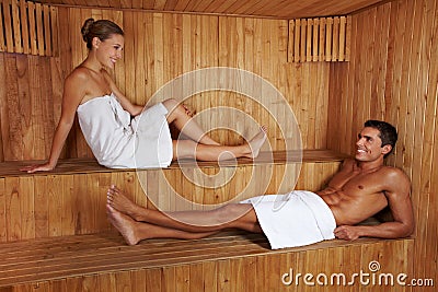 Man and woman talking in sauna