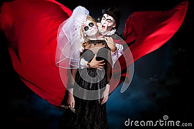 Man and woman wearing as vampire and witch. Halloween