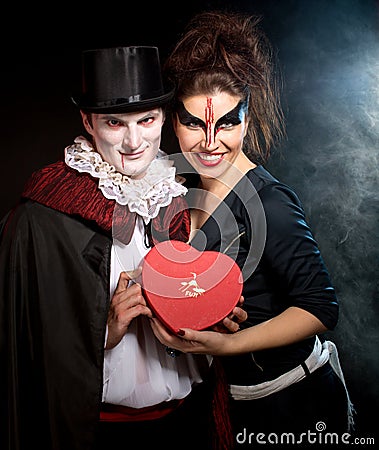 Man and woman wearing as vampire and witch. Halloween