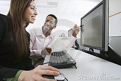 Man And Woman Working Together In Computer Lab