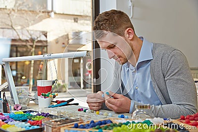 Man working as artisan in jewelry