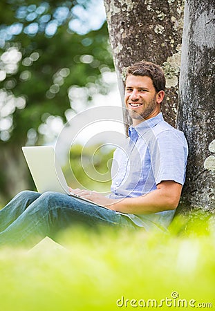 Man working on Laptop Outside