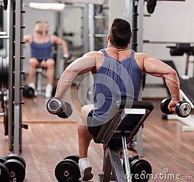 Man working out in front of the mirror