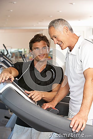 Man Working With Personal Trainer