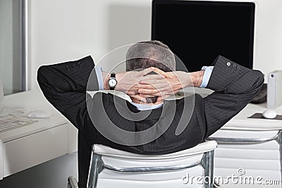Manager leaning back in office