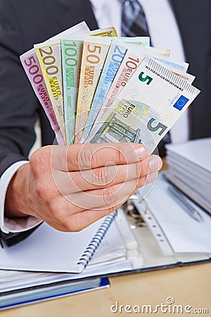 Manager offering Euro money bills