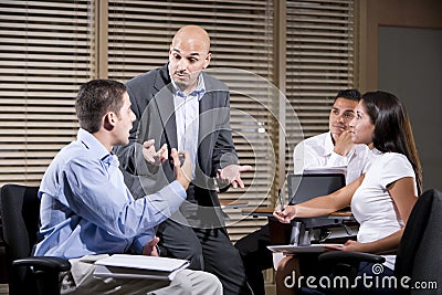 Manager talking with group of office workers