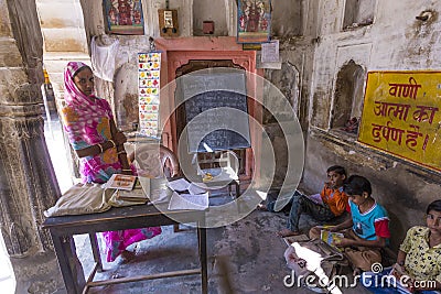 Children and teacher in a village school in Mandawa, India