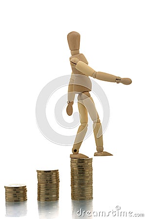 Manikin falling off coin piles