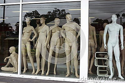 Fashion manikins in display window