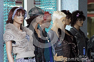 Mannequins on a showcase of a fashion shop