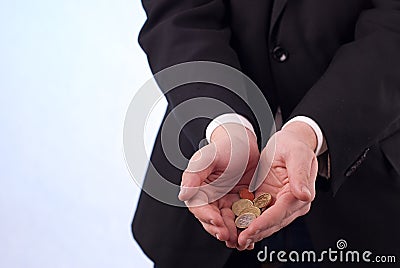 Mans hands with euro coins