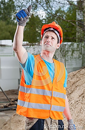 Manual worker showing thumbs up sign