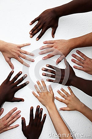 Many hands of persons of various nationalities