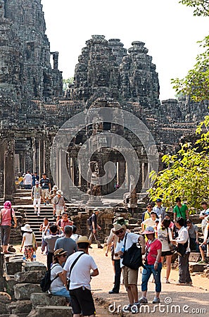 Many tourists at Bayon in Angkor, Cambodia