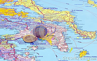 Map of Greece and euro coins