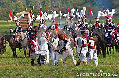 Marching soldiers and horse riders.