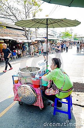 Market woman selling Ice cream.