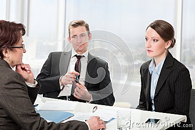 Married couple consults a mature woman lawyer