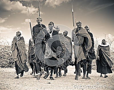 Masai warriors dancing traditional jumps as cultural ceremony,