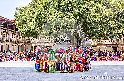 Masked dancers standing together